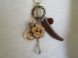 Vintage Whimsy: Antique Gold Necklace with Wood Button and Charms Pendant