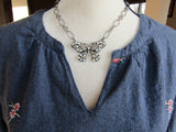 Fluttering Glamour: Rhinestone and Pearl Butterfly Necklace