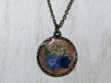 Fluttering Flora: Bronze Necklace with Queen Anne's Lace and Blue Flowers
