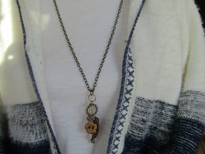 Vintage Whimsy: Antique Gold Necklace with Wood Button and Charms Pendant