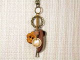 Vintage Whimsy: Antique Gold Necklace with Wood Button and Charms Pendant